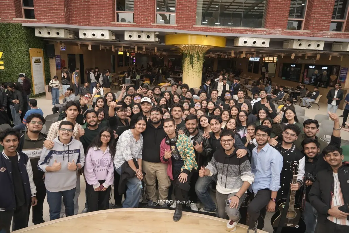 About seventy Mpower JU members packed together in the JECRC University atrium after an event.